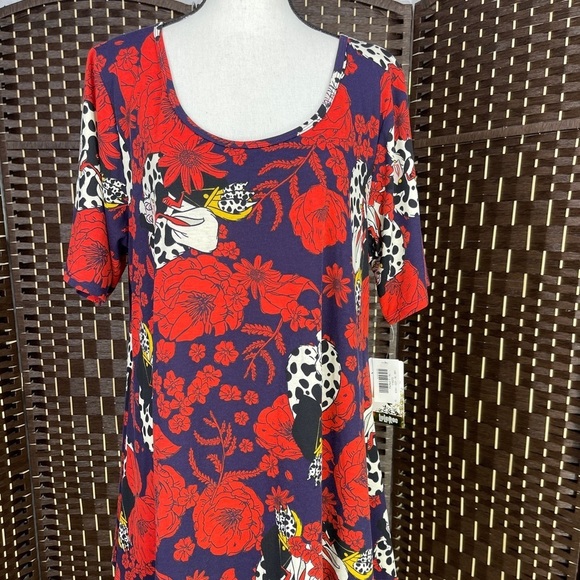 LuLaRoe Tops - Disney LuLaRoe Cruella de Ville Short Sleeve Top